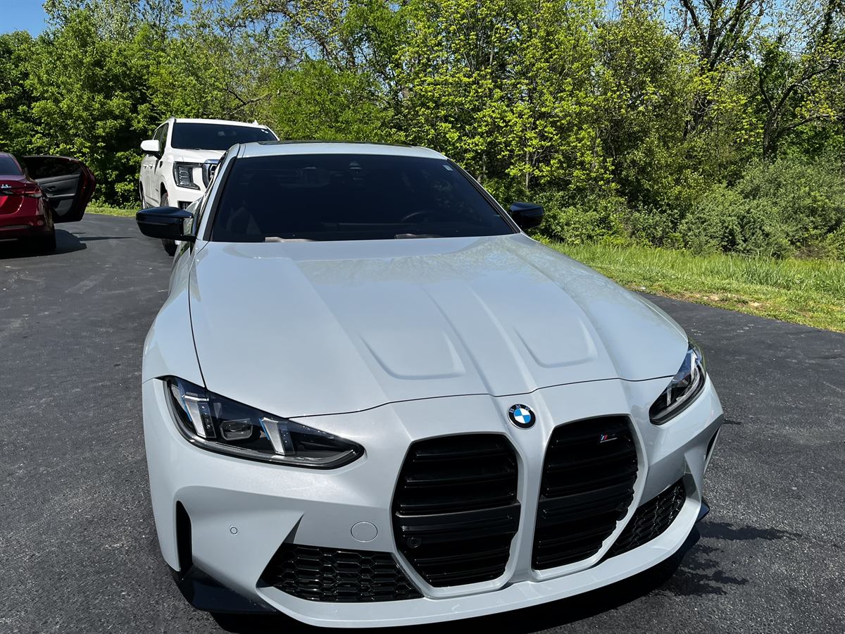 White BMW M4, front three-quarter after a full exterior detail