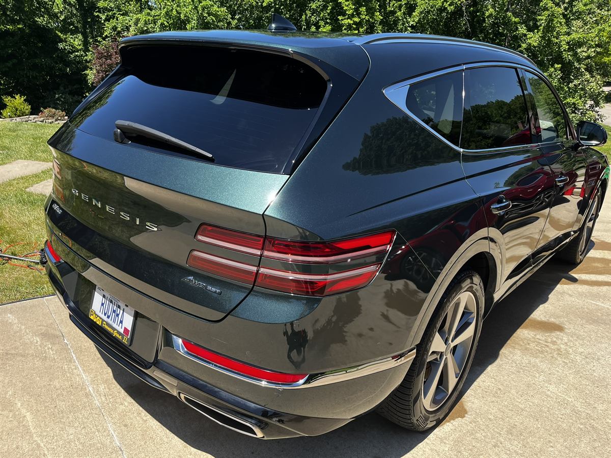 Genesis GV80 rear three-quarter, dark paint after polishing