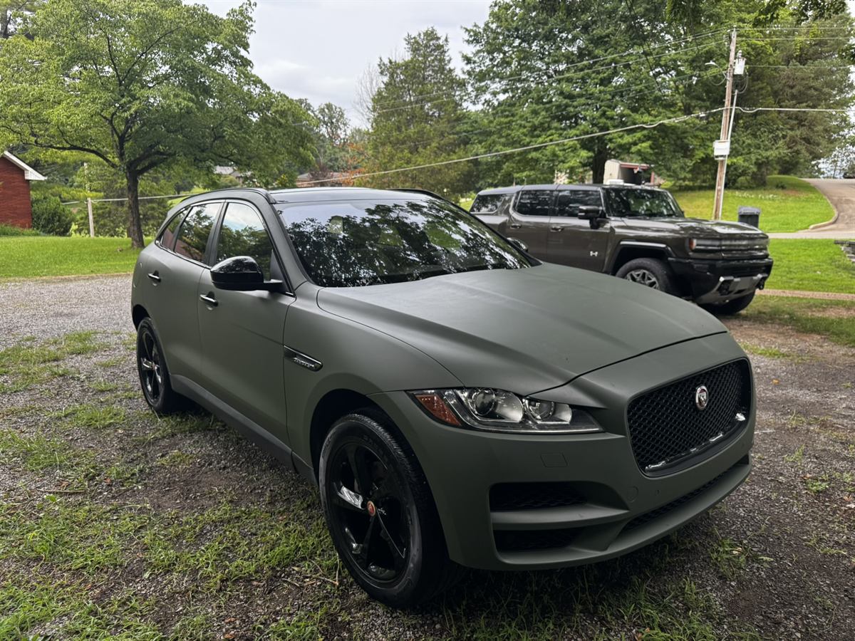 Matte green Jaguar F-Pace after a full exterior detail