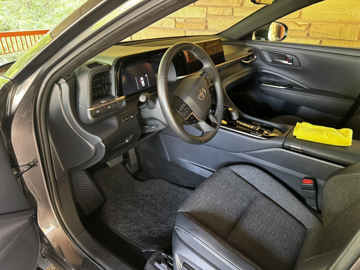 Sedan driver seat and door card after a full interior detail